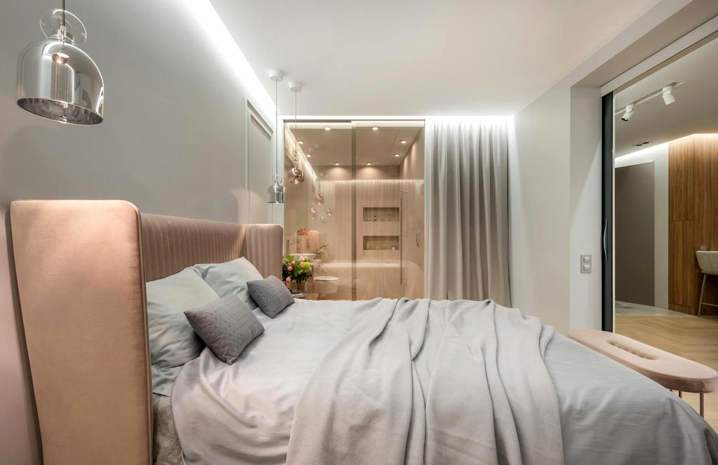 Bedroom with warm amber lighting gradually dimming to support natural sleep cycle