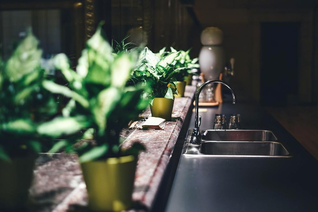 Sarah Mitchell, satisfied client with beautiful home lighting setup