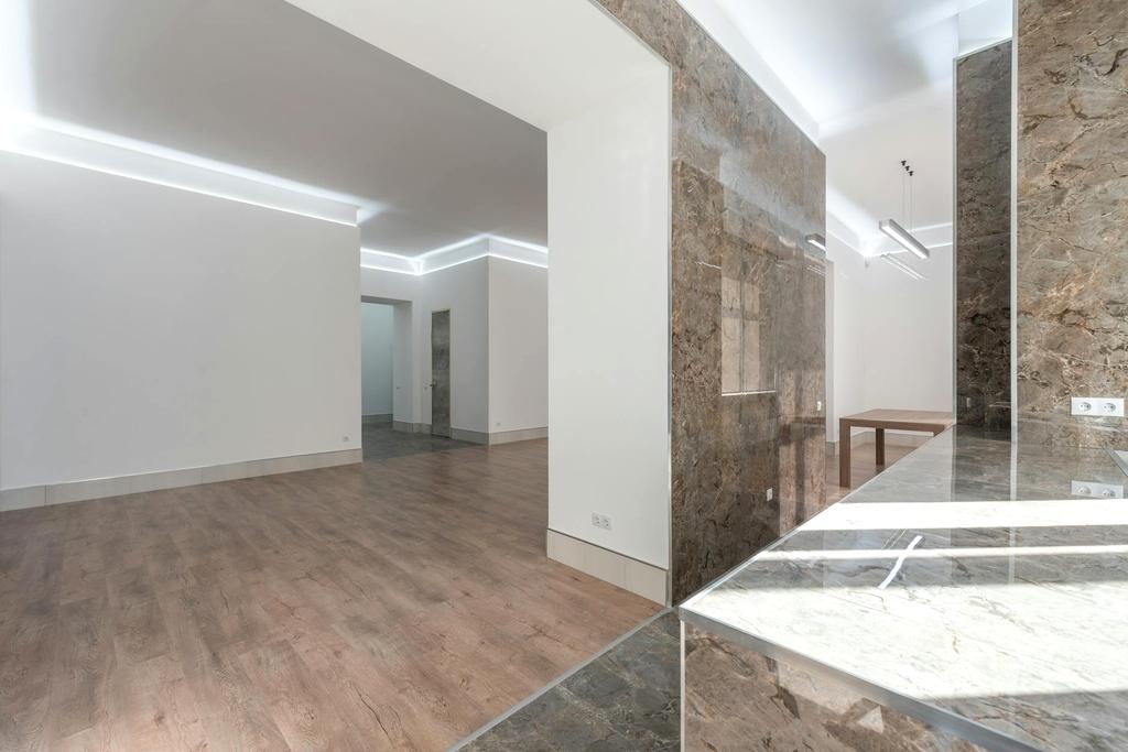 Modern dining area illuminated with balanced neutral lighting